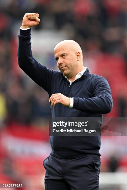 Arne Slot, Manager of Liverpool, celebrates following the team's victory in the Premier League match between Manchester United FC and Liverpool FC at...
