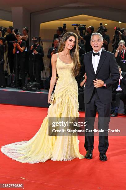 Amal Clooney and George Clooney attend the "Wolfs" red carpet during the 81st Venice International Film Festival on September 01, 2024 in Venice,...
