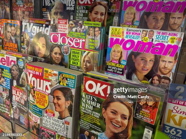 Popular magazines that have been published primarily for the readership of women feature images of the British Royal Family on a newsstand in a...