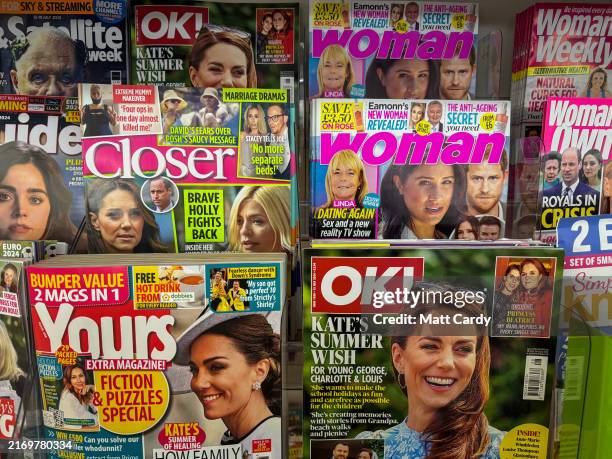 Popular magazines that have been published primarily for the readership of women feature images of the British Royal Family on a newsstand in a...