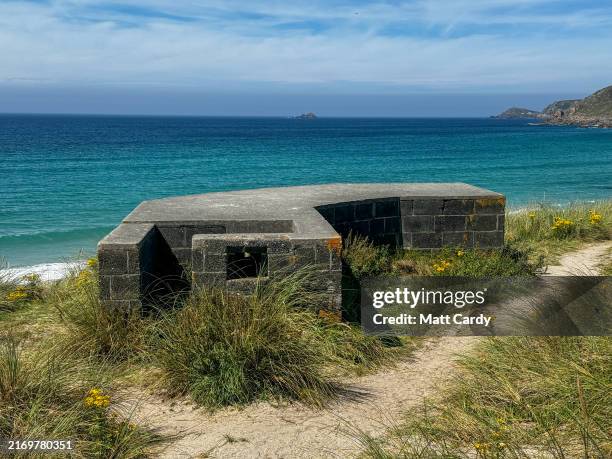 The South West Coast Path passes a Second World War pillbox that still remain overlooking the sea on August 01, 2024 in Cornwall, England. Relics of...