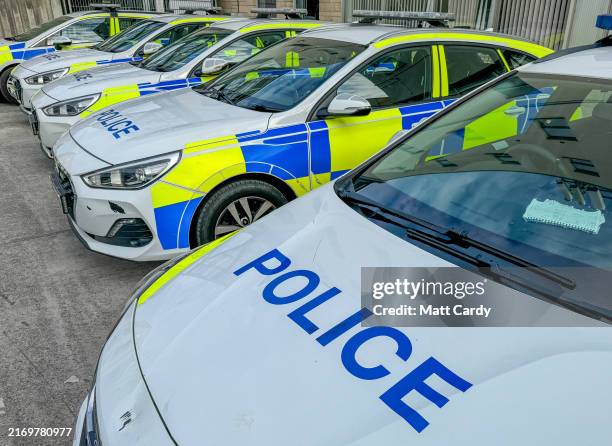 Police cars belonging to the Avon and Somerset Constabulary are parked up while not in use on May 18, 2024 in Bath, England.