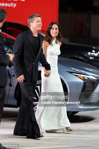 Brad Pitt and Ines de Ramon attend the "Wolfs" red carpet during the 81st Venice International Film Festival on September 01, 2024 in Venice, Italy.