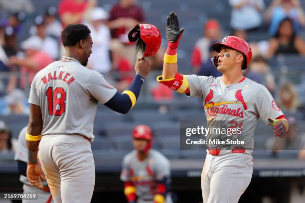Lars Nootbaar of the St. Louis Cardinals celebrates with Jordan Walker after hitting a 2-run home run in the ninth inning at Yankee Stadium on...