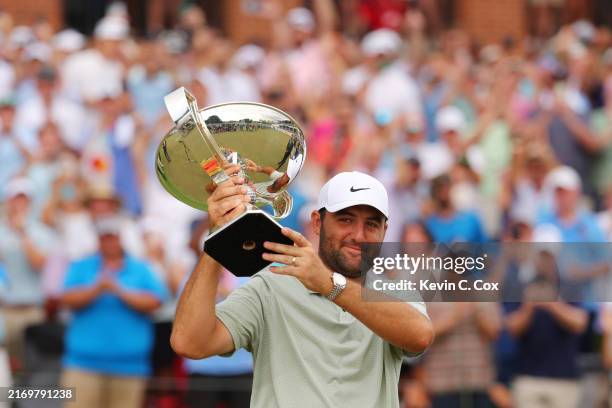Scottie Scheffler of the United States celebrates with the FedExCup Trophy after winning the FedExCup and TOUR Championship at East Lake Golf Club on...
