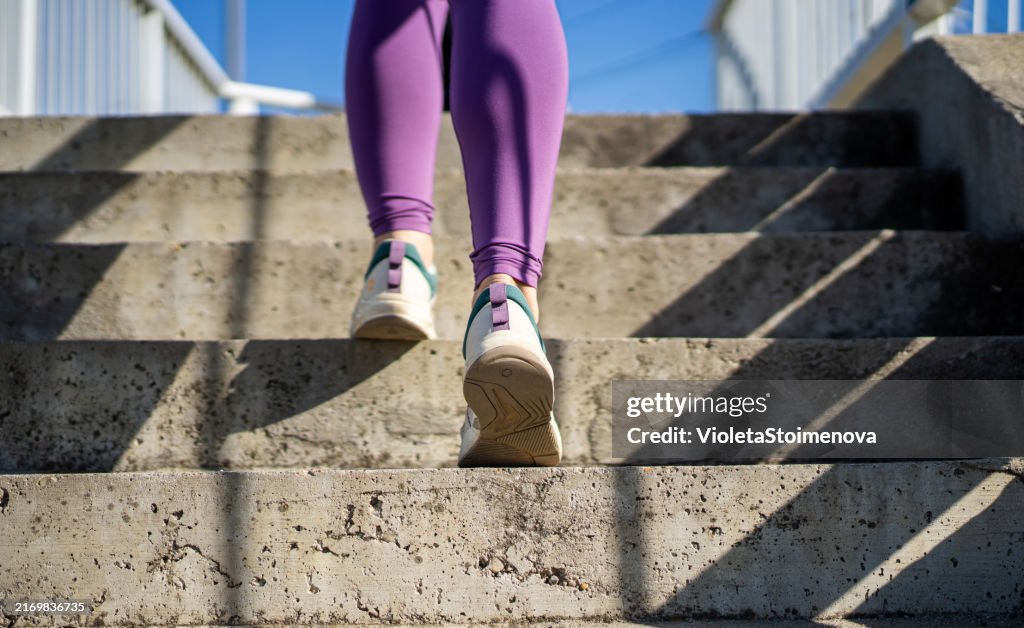 Woman running on the city stairs.