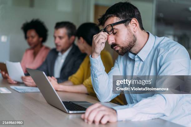 stressed businessman on business meeting in the office. - palestra imagens e fotografias de stock