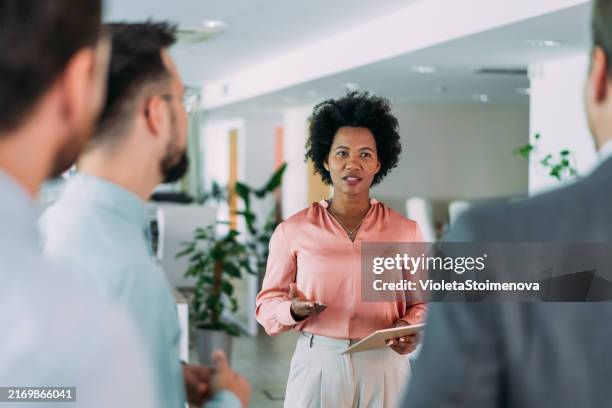 team of professionals during a meeting. - involvement stockfoto's en -beelden