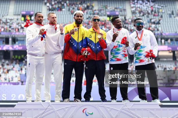 Gold medalist Enderson German Santos Gonzalez of Team Venezuela and his guide Eubrig Jose Maza Caraballo , Silver medalist Timothee Adolphe and his...