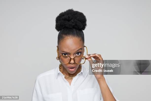 headshot of shocked young businesswoman - suspicion stock pictures, royalty-free photos & images