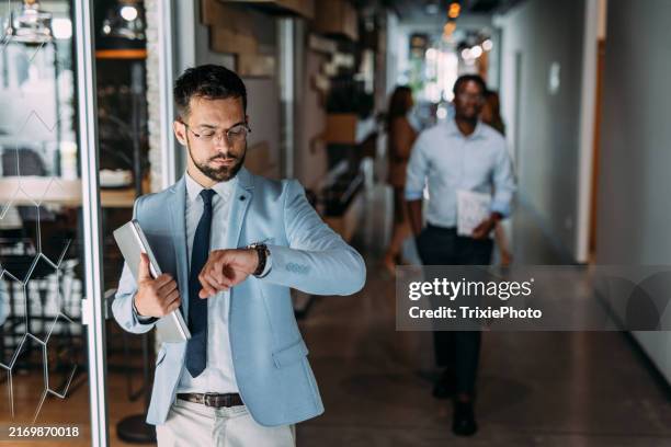 portrait of successful businessman. - checking the time stock pictures, royalty-free photos & images