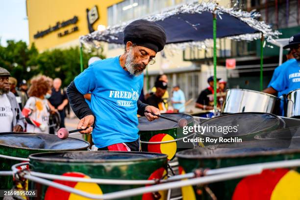 Marchers plays a Steelpan during J'Ouvert in the Crown Heights neighborhood in Brooklyn on September 02, 2024 in New York City.
