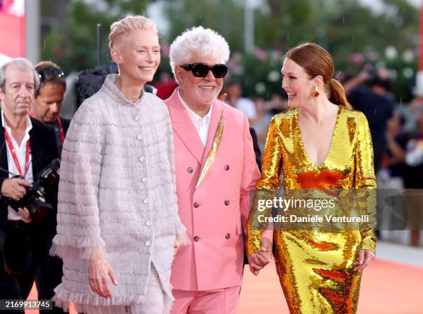 Tilda Swinton, Pedro Almodovar and Julianne Moore attend the "The Room Next Door" red carpet during the 81st Venice International Film Festival on...