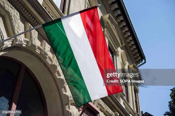 The Hungarian national flag waves on a building in Budapest.