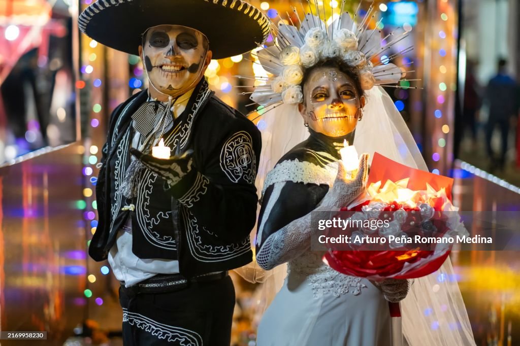 Portrait of a bride and groom on the night of the dead