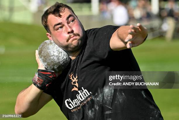 Competitor takes part in the shot put competition during the annual Braemar Gathering in Braemar, central Scotland, on September 7, 2024. The Braemar...