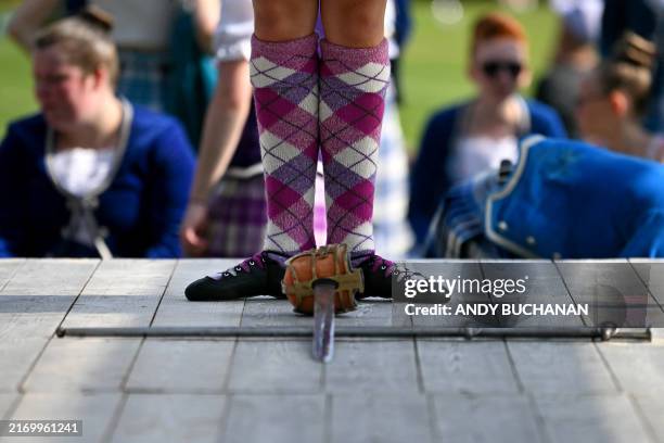 Sword dancer takes part in a competition during the annual Braemar Gathering in Braemar, central Scotland, on September 7, 2024. The Braemar...
