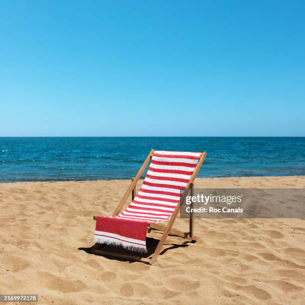 relaxation on the beach - striped towel stock pictures, royalty-free photos & images