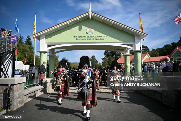 Participants perform during the Massed Pipe Band parade during the annual Braemar Gathering in Braemar, central Scotland, on September 7, 2024. The...