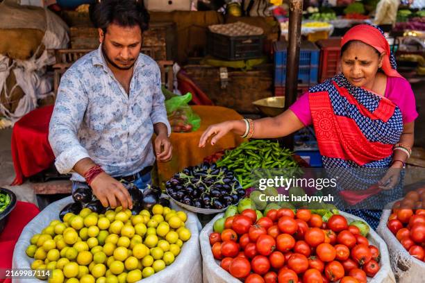 indian street sellers selling vegetables in jaipur, india - india street food stock-fotos und bilder