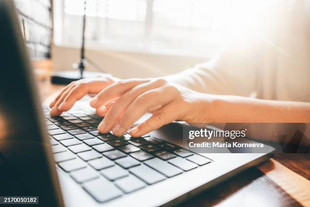 woman working at home office. close up hand on laptop keyboard. - enter key stock pictures, royalty-free photos & images