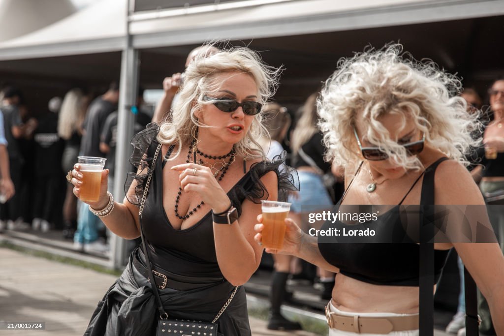 Two beautiful senior female friends at a dance event