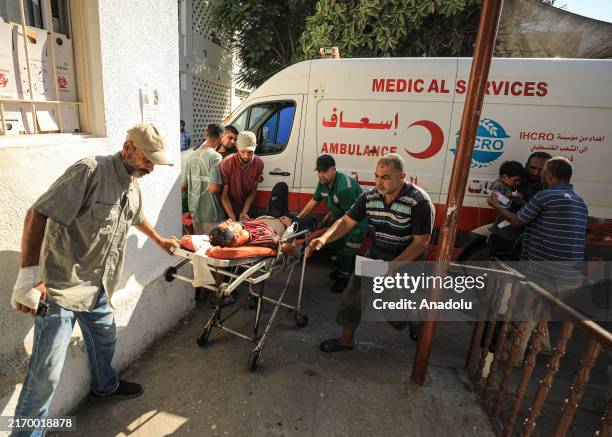 The bodies of the wounded, including children, and the bodies of the deceased are being brought to Al-Ahli Baptist Hospital, in Gaza City, Gaza on...