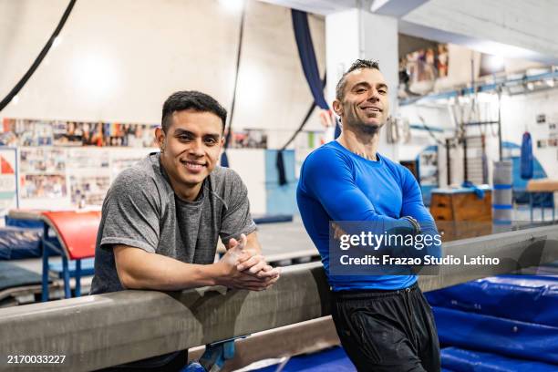 portrait of male friends in a gym - artistic gymnastics stock pictures, royalty-free photos & images