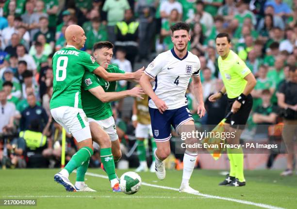 Republic of Ireland's Will Smallbone and Dara O'Shea pull back on England's Declan Rice during the UEFA Nations League Group F match at Aviva...