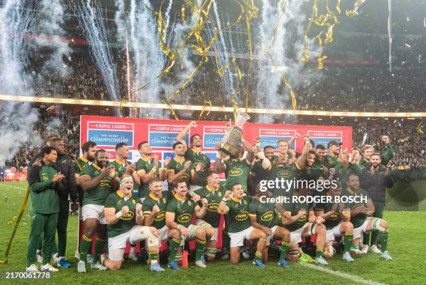 South Africa's Springbok rugby team celebrates after defeating New Zealand at the end of the Rugby Championship Test match between South Africa and...