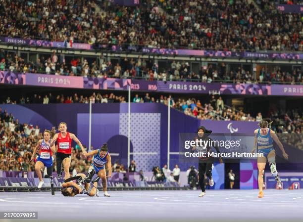 Ambra Sabatini and Monica Graziana Contrafatto of Team Italy falling at the finish line while Martina Caironi of Team Italy wins Gold in the Women's...