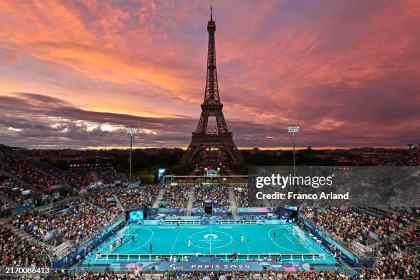 General view of the action at sunset with the Eiffel Tower in the background during the Men's Preliminary Round Group A - Match 11 on day six of the...