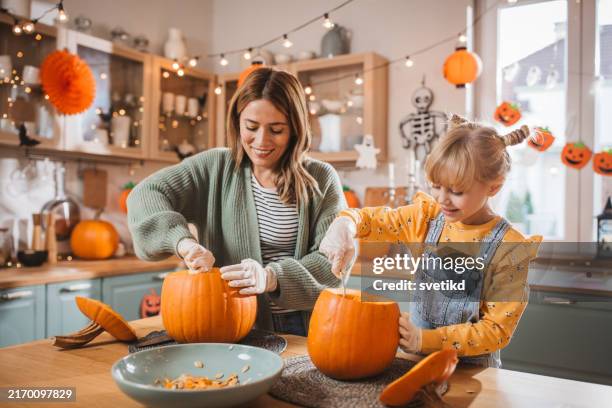 joyfully preparing for halloween - carving food stock pictures, royalty-free photos & images