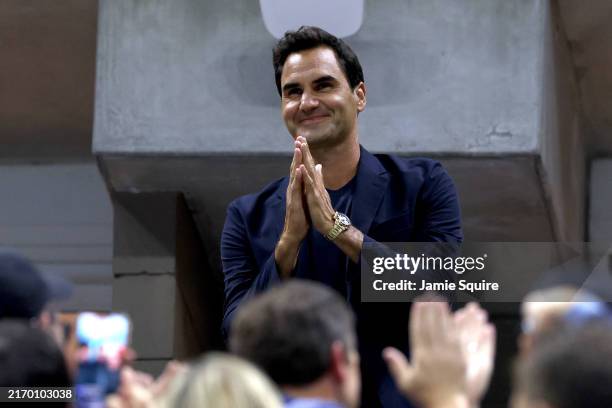 Roger Federer is recognized during the Women's Singles Quarterfinal match between Zheng Qinwen of China and Aryna Sabalenka of Belarus on Day Nine of...
