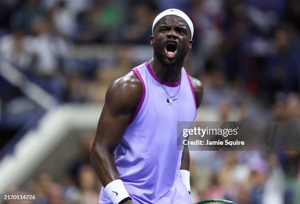 Frances Tiafoe of the United States reacts after holding serve against Grigor Dimitrov of Bulgaria during their Men's Singles Quarterfinal match on...