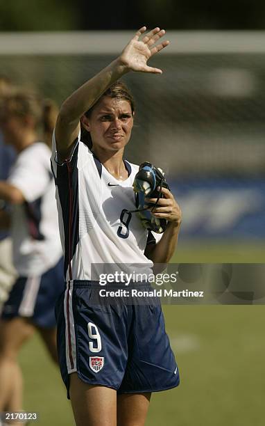 Mia Hamm of the U.S. Women's national team waves to the fans after defeating the Brazil Women's national team at Tad Gormley Stadium on July 13, 2003...