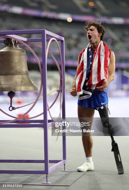 Ezra Frech of Team United States celebrates rings the world record bell after the Men's High Jump - T63 on day six of the Paris 2024 Summer...