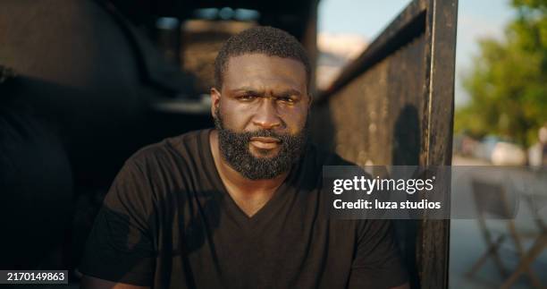 closeup portrait of bearded food truck owner looking at camera outdoors - smokehouse stock pictures, royalty-free photos & images