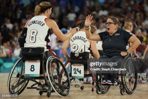 Head coach Christina Schwab of Team United States celebrates with Natalie Schneider of Team United States after their victory against Team Great...