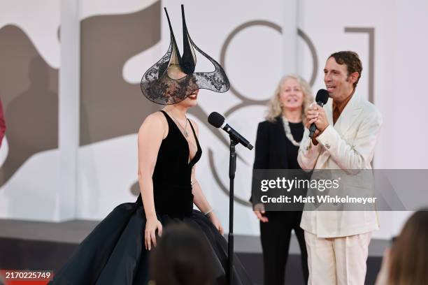 Lady Gaga speaks during interview during the "Joker: Folie à Deux" red carpet during the 81st Venice International Film Festival at Sala Grande on...