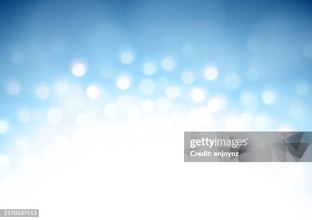 sparkling glittering winter christmas light vector illustration on blue background - winter wedding stock illustrations
