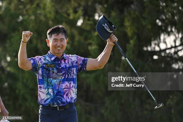 Yang of South Korea reacts after making a birdie putt during a playoff against Bernhard Langer of Germany on the 18th green to win the final round of...