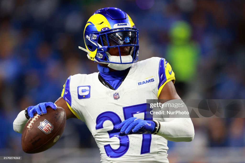 Detroit Rams Safety Quentin Lake of the Los Angeles Rams reaches to throw the ball ...