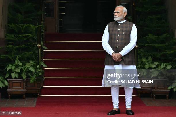 India's Prime Minister Narendra Modi waits for the arrival of Abu Dhabi's Crown Prince Sheikh Khaled bin Mohamed bin Zayed Al Nahyan at the Hyderabad...