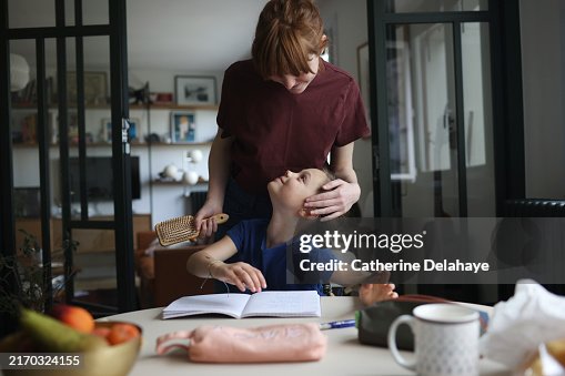 A mother and her 8 year old daughter at home A mother and her 8 year old daughter at home