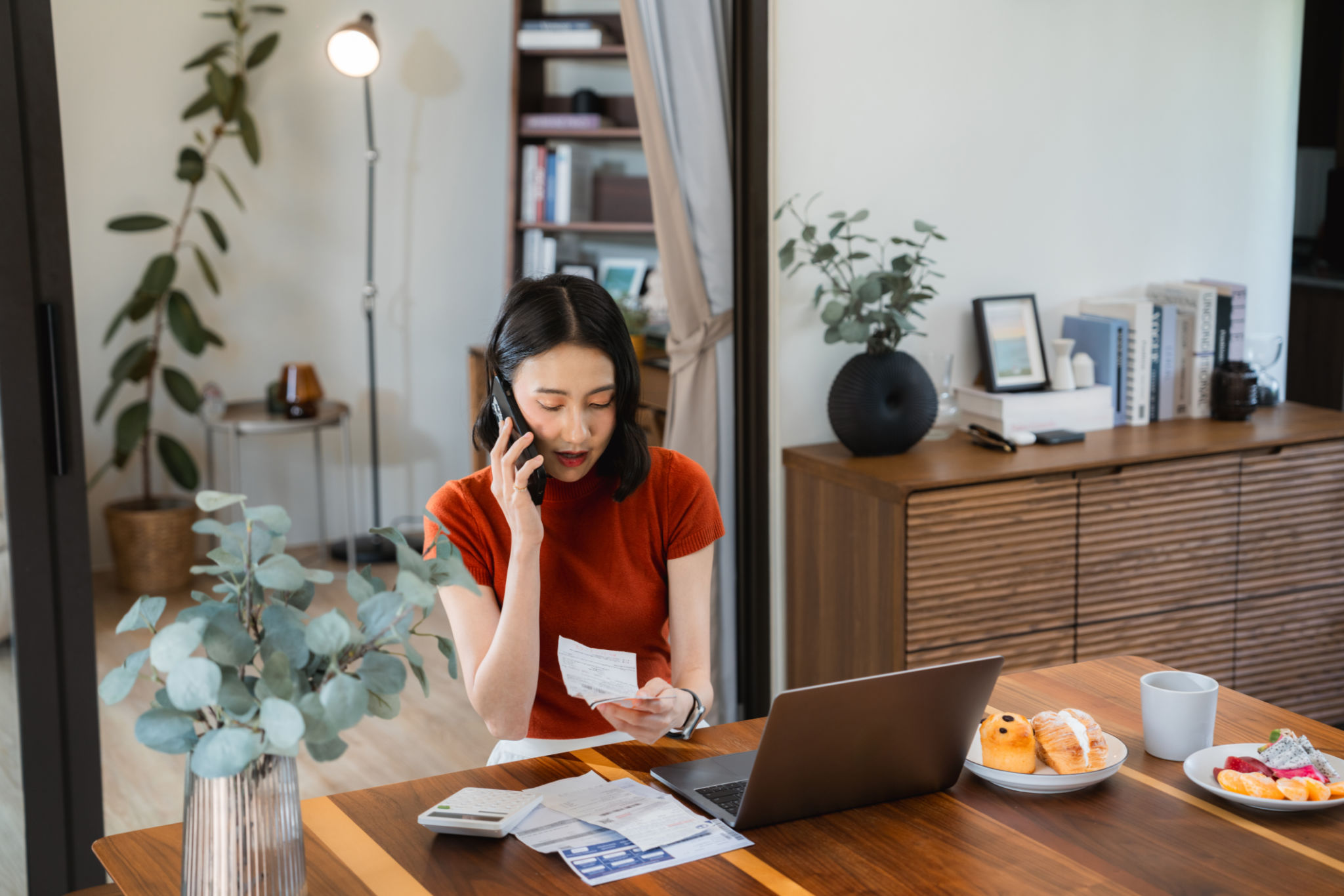Young woman Paying Bills Online at home Young woman Paying Bills Online at home