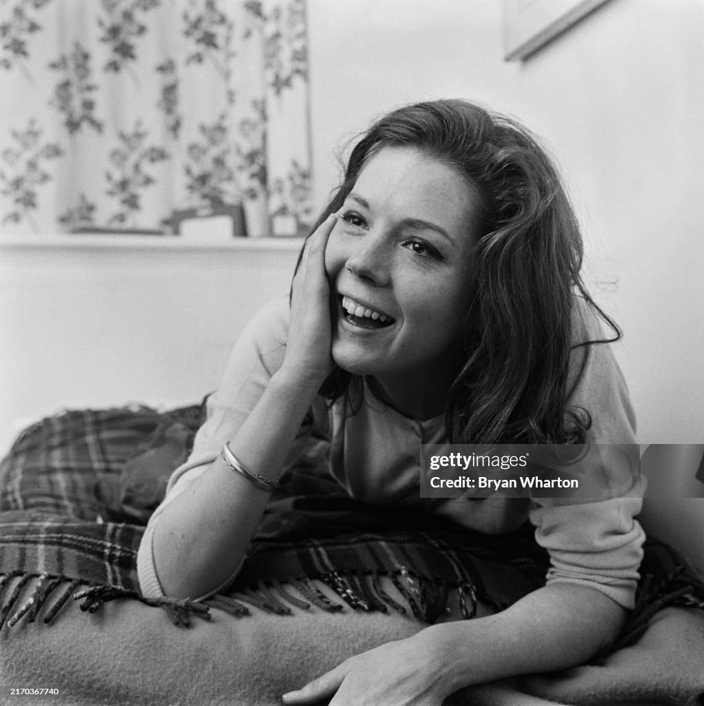 Angiediana Rigg Actress Diana Rigg laughs while reclining on a bed,... News Photo ...