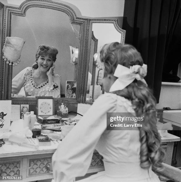 Patricia Routley Actress Patricia Routledge smiles in her dressing room mirror while ...