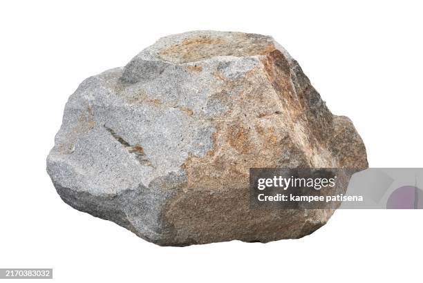 a rough stone isolated on white - roche photos et images de collection