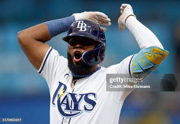 Junior Caminero of the Tampa Bay Rays reacts to a two RBI single in the third inning during a game against the Minnesota Twins at Tropicana Field on...